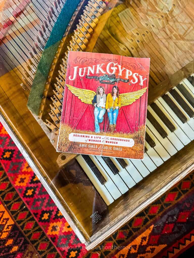 junk gypsy book on piano coffee table