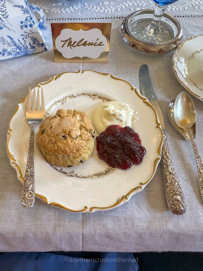 currant scone with clotted cream and blackberry jam